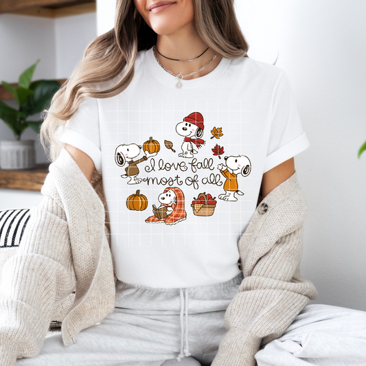 a woman wearing a white shirt with cartoon characters on it